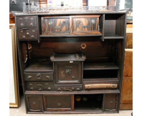A Japanese open shelf unit with sliding doors and applied metal work
