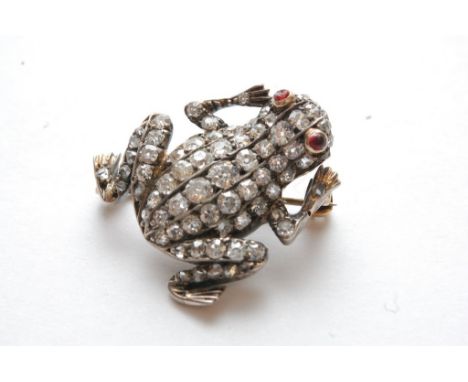 A fine quality vintage diamond encrusted frog brooch set with ruby eyes