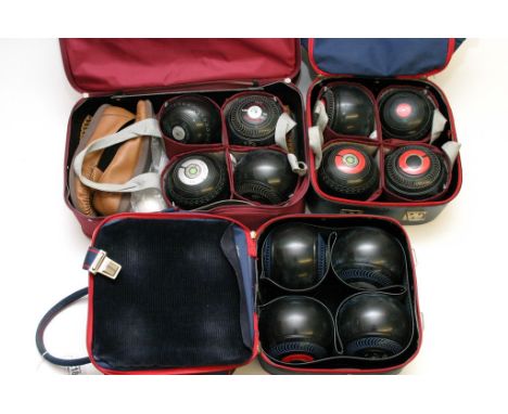 A collection of assorted vintage lawn bowls in three bags