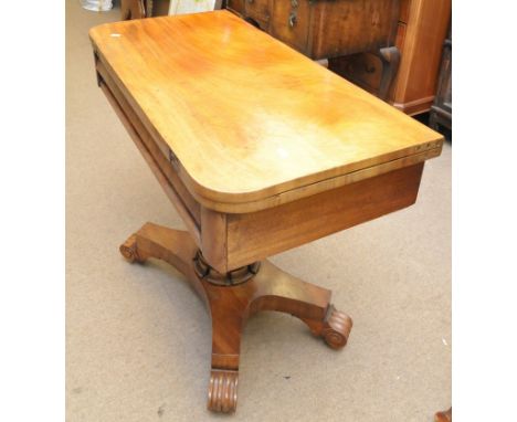 A Victorian mahogany card table, the twin flap top on an octagonal column and platform base