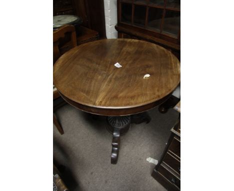 A 19th century mahogany occasional table having a bulbous fluted column on tripod base