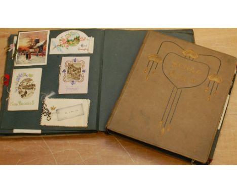 Two postcard albums including Louis Wain