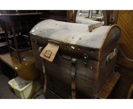 A domed leather bound trunk
