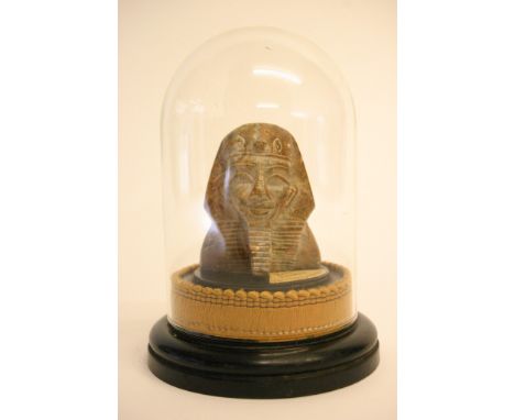 A small vintage alabaster head of Tutankhamun under a glass dome 