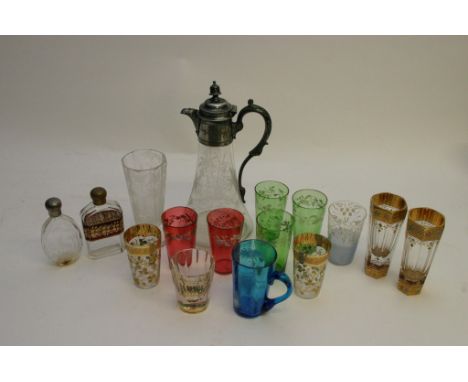 A collection of Victorian and latter glass ware Mary Gregory style including Claret jug,beakers with silver plated mounts and