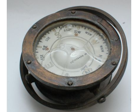 A gimbled brass compass