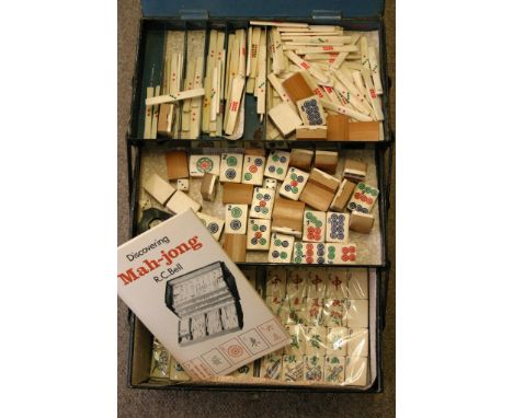 A vintage Mahjong set in a metal case