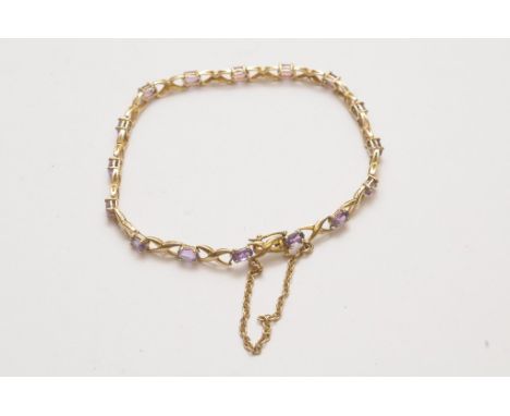 A 9ct gold bracelet set with amethyst coloured stones