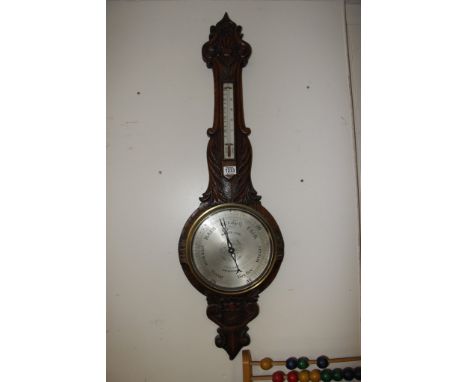 A Victorian carved oak barometer, Maker Moses Ash Birmingham 