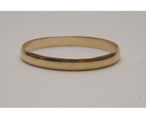 A 9ct gold bangle