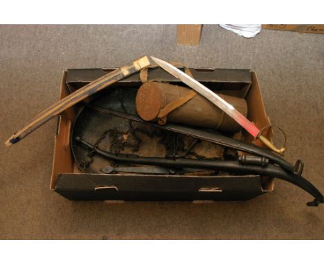 A box containing a set of horse hames, a small sword and scales