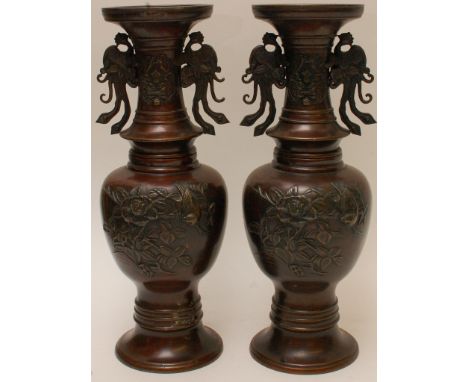 A pair of 19th Century Bronze Chinese Vases with raised flowers and foliage 