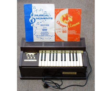 A Rosedale, electric, two octave, 6 button, chord organ, comes in it's original box
