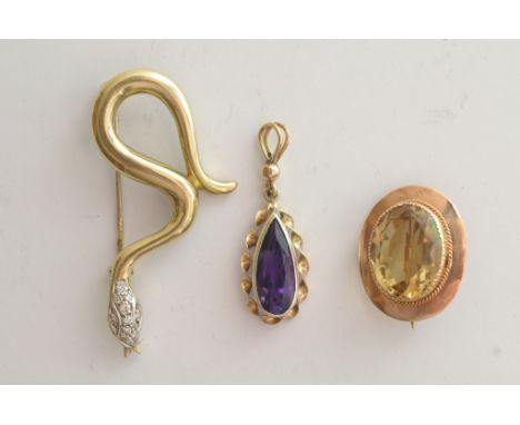 A 9ct yellow gold brooch in the form of a snake with diamond set head together with a 9ct gold and amethyst pendant and a 9ct