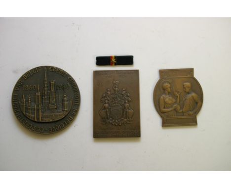 A collection of three cased bronze medallions of varying design