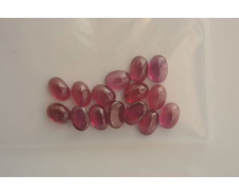 A collection of fifteen oval shaped ruby cabochons, 10ct approximately