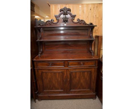 A Victorian mahogany buffet or sideboard with raised shaped back