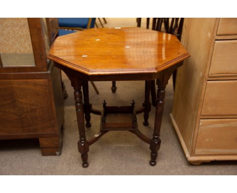 A walnut octagonal top occasional table having turned legs and under shelf