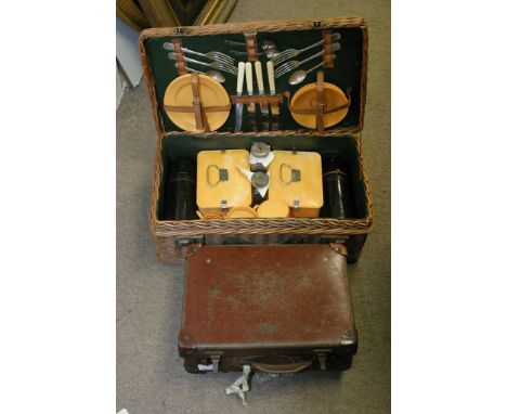 A Vintage wicker picnic hamper with contents together with an old small brief case