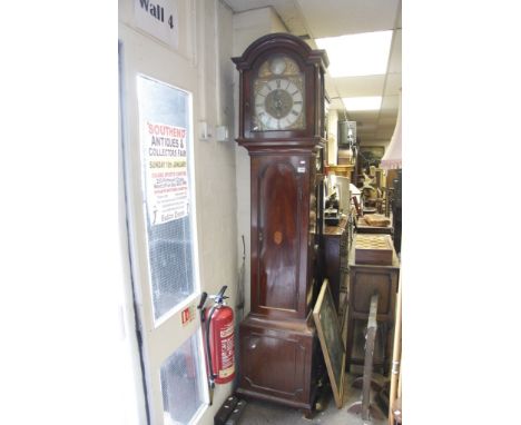 A Mahogany Longcase clock the arched brass dial with Roman numerals and second subsidiary dial 