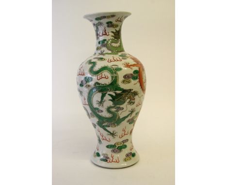A quality Chinese vase decorated with iron red, green, purple and yellow glaze five clawed dragons and a flaming pearl, the b