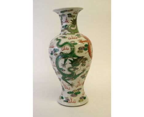 A quality Chinese vase decorated with iron red, green, purple and yellow glaze five clawed dragons and a flaming pearl, the b