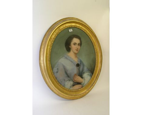 A 19th century gilt framed oil pastel picture depicting the portrait of a young lady