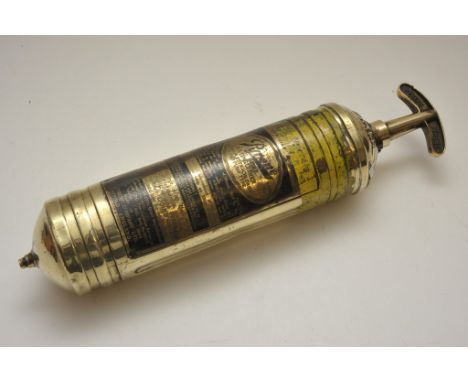 A vintage brass British Rail Pyrene fire extinguisher