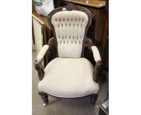 A Victorian walnut chair with button back upholstered seat and turned supports 