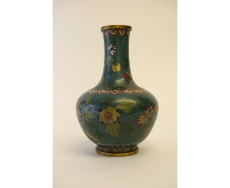 A Chinese gilt bronze and cloisonne enamel vase decorated with flowers and foliage. Height: 27cm approximately