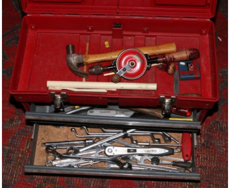 A red multi compartment tool box and contents of mainly engineering tools, spanners, sockets etc.