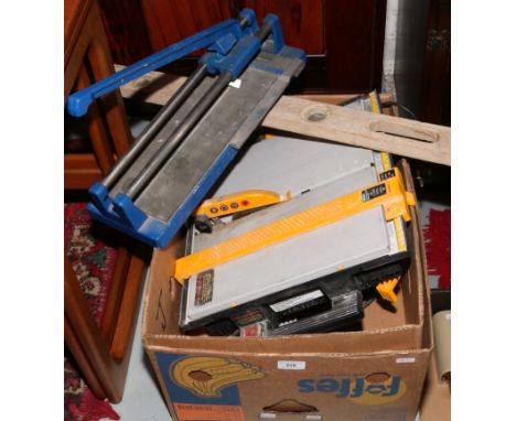 A Plasplugs electric tile cutter,&nbsp; tile slice and a Rabone Chesterman teak spirit level.