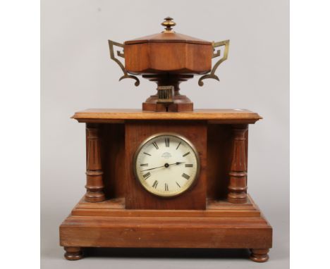 A rare early 20th century Davidson's patent automatic memorandum clock in mahogany case, with octagonal twin handled urn shap