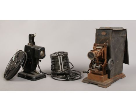 An early 20th century hand crank projector by J. Falk, along with a pathescope kid projector.