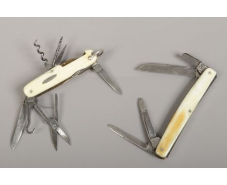 A Victorian multi tool folding pocket knife by Clements of Sheffield (one spring broken) along with a similar multi tool knif
