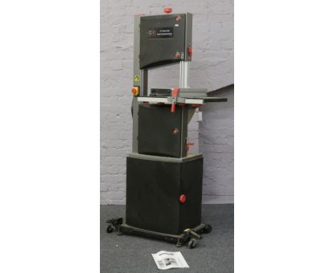 A S.I.P 14" heavy duty floor mounted wood cutting band saw with instruction manual and spare blades.