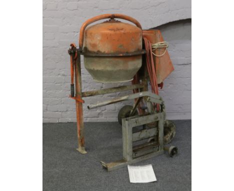 A 230 volt Hobbymix 120 cement mixer on tipping stand with spare parts and assembly manual, along with a heavy duty Sirchwood