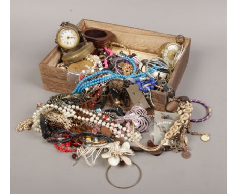 A box of costume jewellery to include Oris manual wristwatch, simulated pearls, brass desk clock etc.