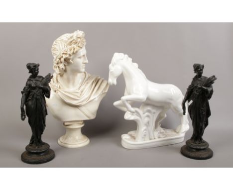 A group lot including a pair of spelter figures, composite bust of Apollo, ceramic rearing horse etc.