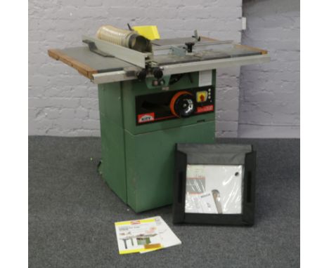 A Kity 240 volt circualr saw bench model 100618 fitted with 270mm blade, along with instruction manual, spare blades and acce