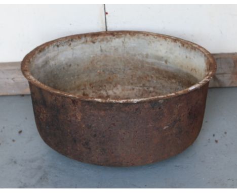 A circular cast iron trough, diameter 72cm.
