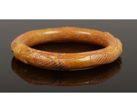 A Chinese hardstone bangle.