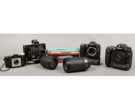 A collection of photographic to include Nikon D2 X and D80 cameras, Nikon lenses, Polaroid Instant 20 etc.