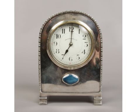 A Walker &amp; Hall Limited silver plate mantle clock housing a French movement.Condition report intended as a guide only.Den