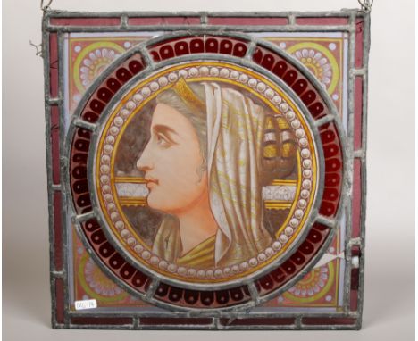 A coloured and leaded glass panel with hand painted panel depicting a portrait of a women wearing a headress. (approx 37cm X 