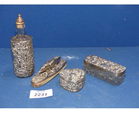 A small quantity of embossed silver items to include: a glass hobnail cut pot with silver lid (a/f), a heart shaped trinket b