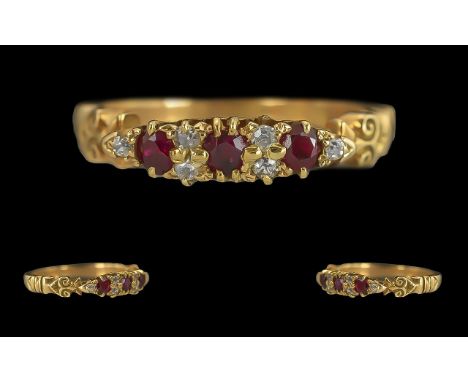 Ladies 18ct Gold Pleasing Diamond and Ruby Set Ring with ornate raised setting, marked 18ct to interior of ring, ruby and dia