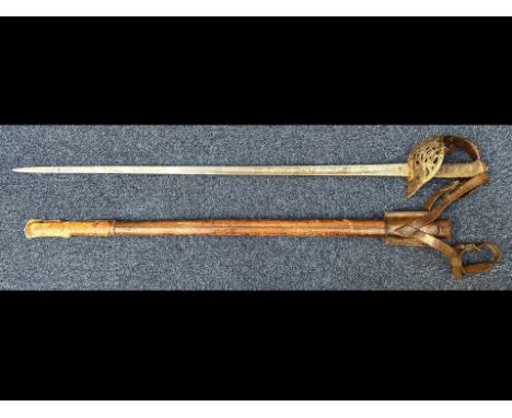 A WWI British Infantry Officer's Sword, Henry Wilkinson hilt, with leather scabbard, etched blade, as found condition, pitted