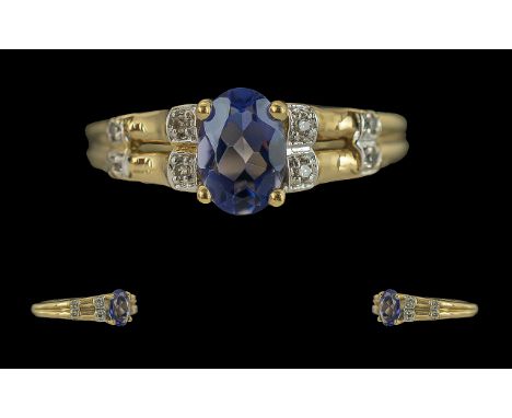 Ladies 9ct Gold Tanzanite and Diamond Set Ring. Full Hallmark to Interior of Shank. The Central Faceted Tanzanite of Good Col