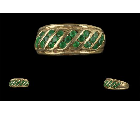 Ladies Pleasing 14ct Gold Emerald Set Dress Ring. Full Hallmark to Interior of Shank. The Well Matched Emerald of Good Colour
